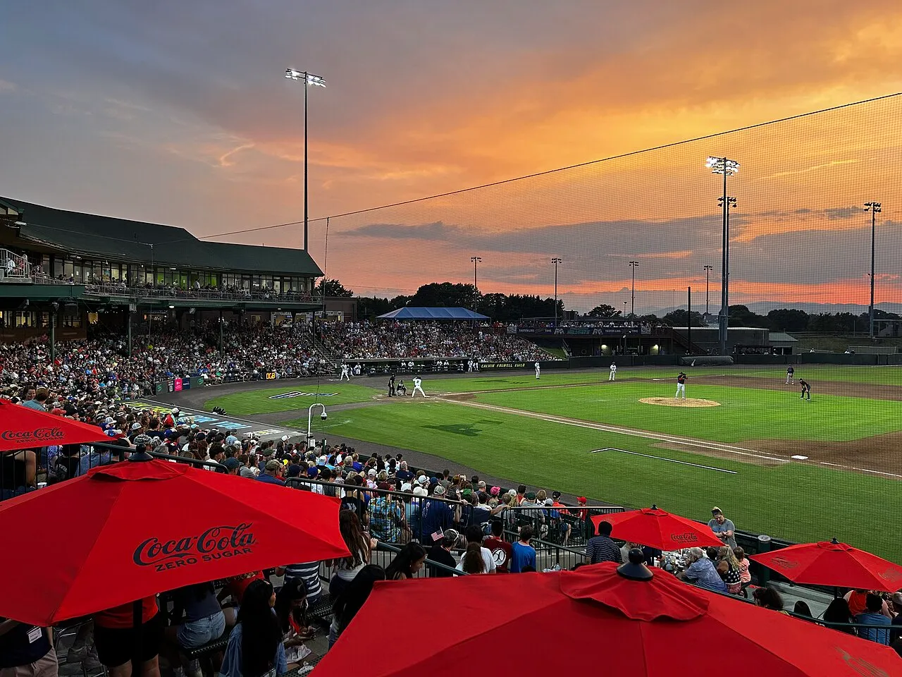 A night game at Lynchburg's ballpark under a sunset sky