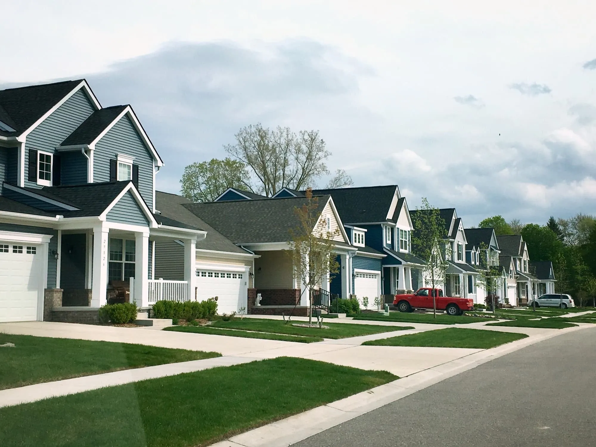 Row of new two-story homes along a neighborhood street