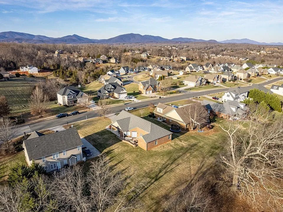 Aerial view of a neighborhood with mountains on the horizon