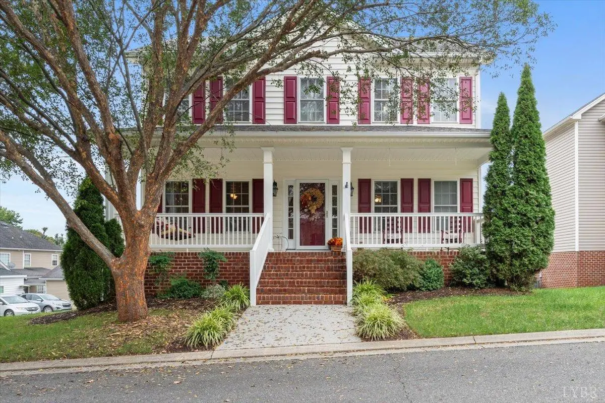 Front of the house with red shutters and a covered front porch at 102 Wyndview, Lynchburg VA
