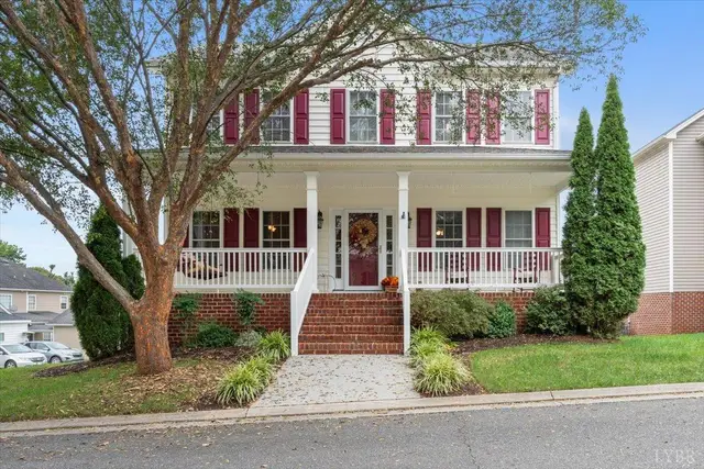 Front of the house with red shutters and a covered front porch at 102 Wyndview, Lynchburg VA