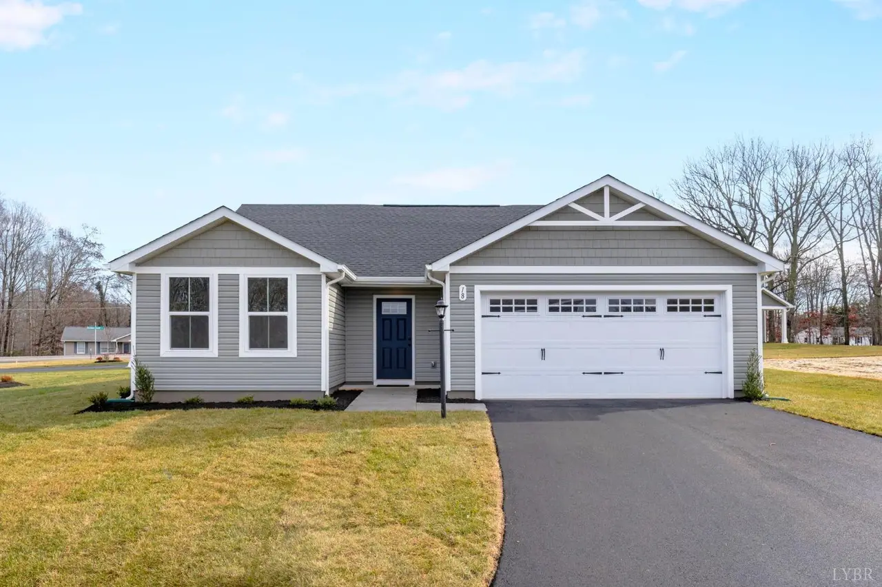 Front of the house with a white two-car garage and paved driveway at 107 Kade Court, Lynchburg VA