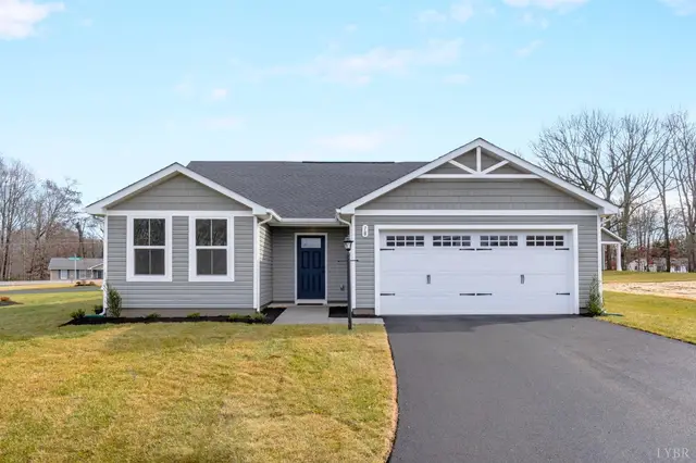 Front of the house with a white two-car garage and paved driveway at 107 Kade Court, Lynchburg VA