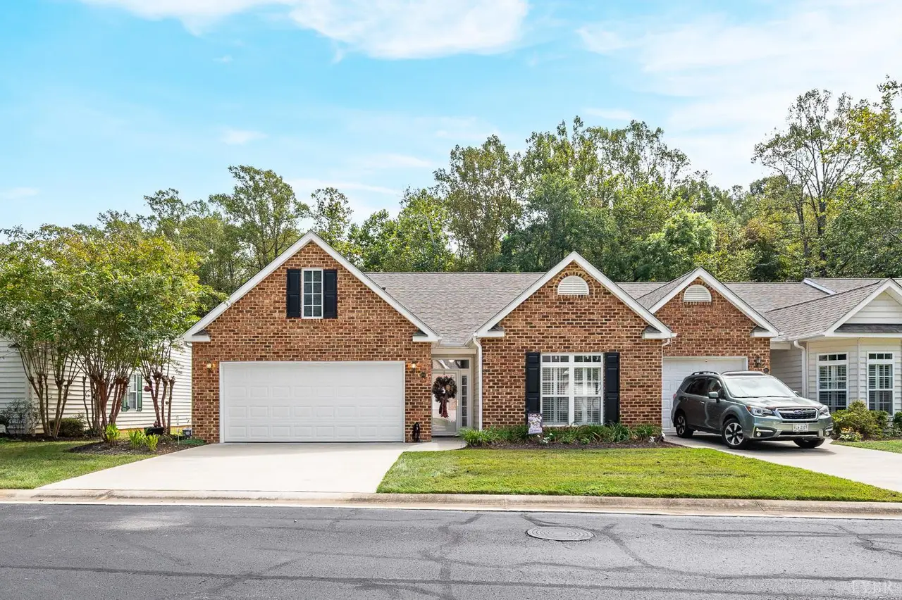 Front of the brick townhome with a garage at 109 Jonathan's Landing, Lynchburg VA
