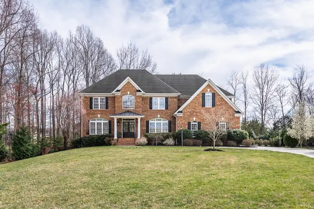 Front of the brick house with a wide front lawn at 1108 Half Moon Court, Forest VA