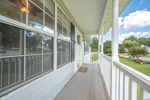 Covered front porch with white railings and columns at 111 Willow Bend Drive, Lynchburg VA