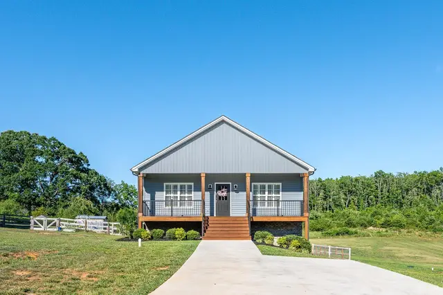 Front of the house with blue siding and a covered front porch at 1119 Dodson Drive, Rustburg VA