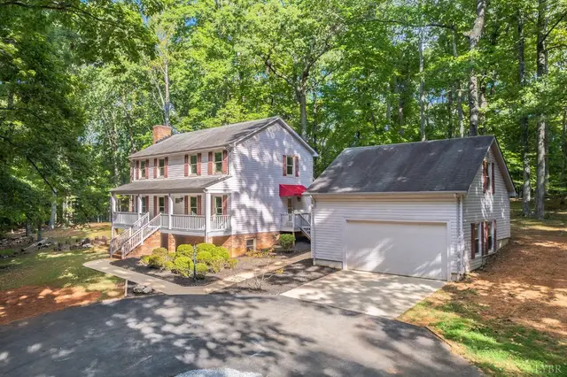 House with a detached garage and paved driveway at 1149 Fleming Mountain Drive, Lynchburg VA