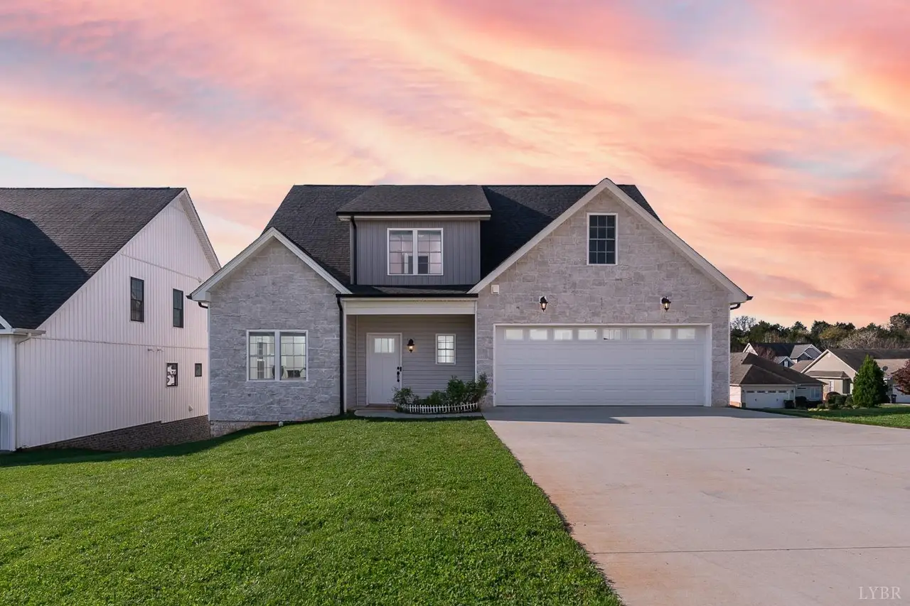 Front of the house with a two-car garage at sunset at 1151 Harborough Drive, Forest VA