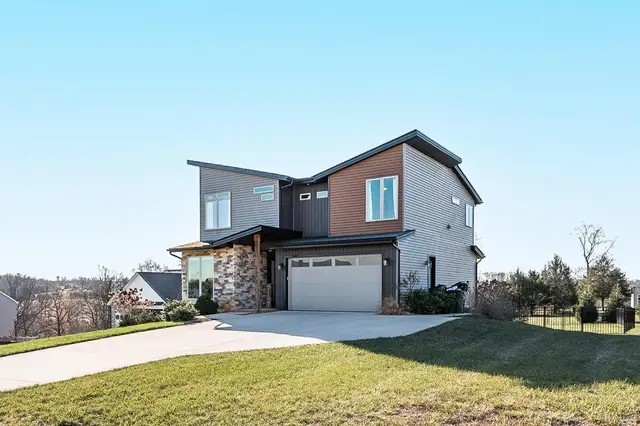 Front of the house, two-story modern with stone accents and a two-car garage at 1172 Jefferson Meadows Drive, Forest VA
