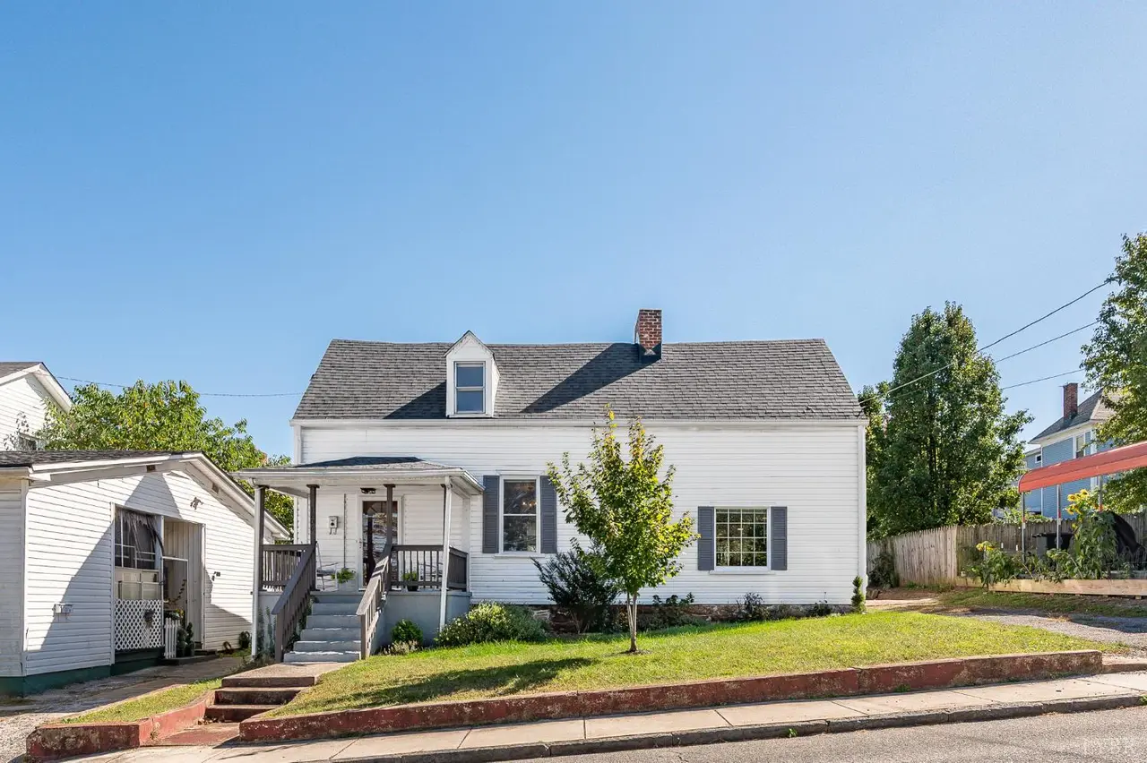 Front of the house, white Cape Cod with dormers and a small front porch at 1206 10th Street, Lynchburg VA