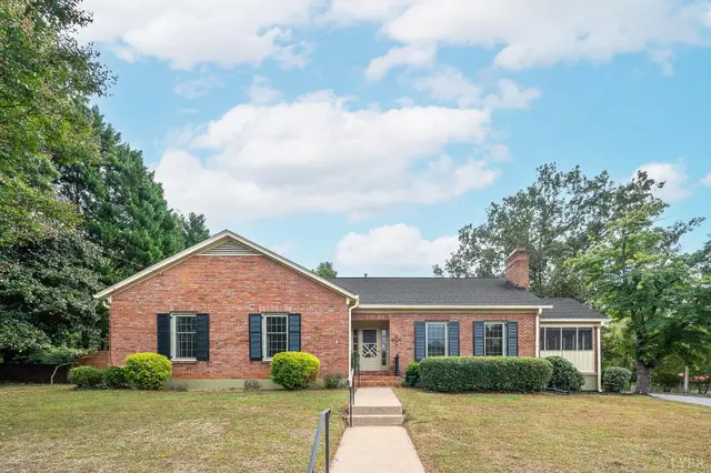 Front of the house, one-story brick with black shutters and a front walkway at 1264 Krise Circle, Lynchburg VA