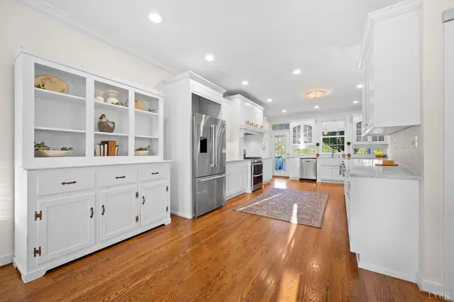 Kitchen with a white built-in hutch and a stainless steel refrigerator at 1351 Country Estates Drive, Lowry VA