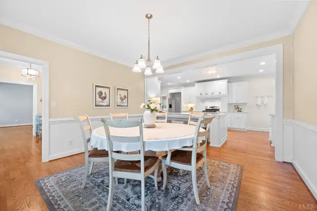 Dining room with a round table, looking into the kitchen at 1351 Country Estates Drive, Lowry VA