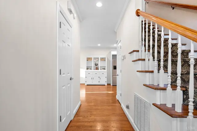 Hallway beside the staircase with a carpet runner at 1351 Country Estates Drive, Lowry VA