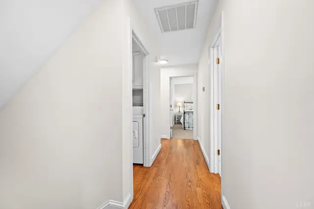 Upstairs hallway with hardwood floors at 1351 Country Estates Drive, Lowry VA