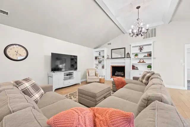 Family room with a fireplace between built-in shelves at 1351 Country Estates Drive, Lowry VA