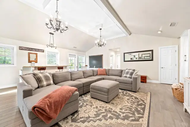 Family room with a large sectional, looking toward a breakfast bar at 1351 Country Estates Drive, Lowry VA