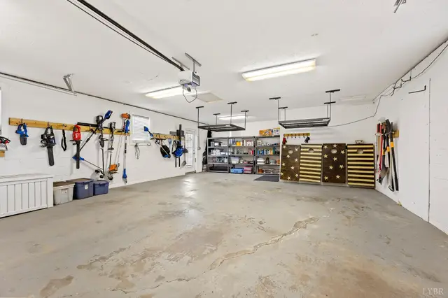 Garage with wall mounted tools and metal shelving at 1351 Country Estates Drive, Lowry VA