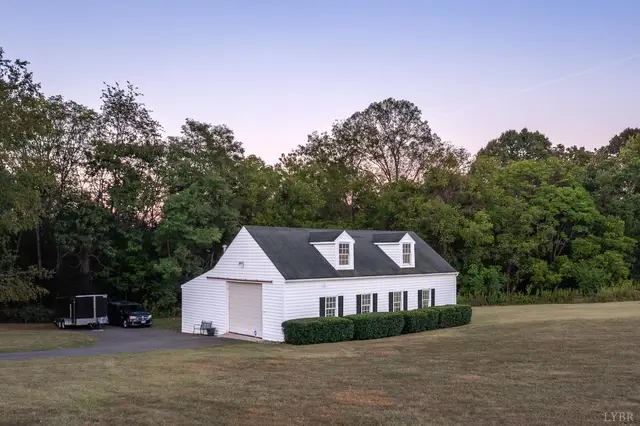 Detached garage with dormers and a paved driveway at 1351 Country Estates Drive, Lowry VA