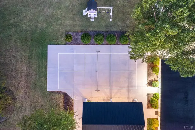 Aerial view looking down on the sport court and a playset at 1351 Country Estates Drive, Lowry VA