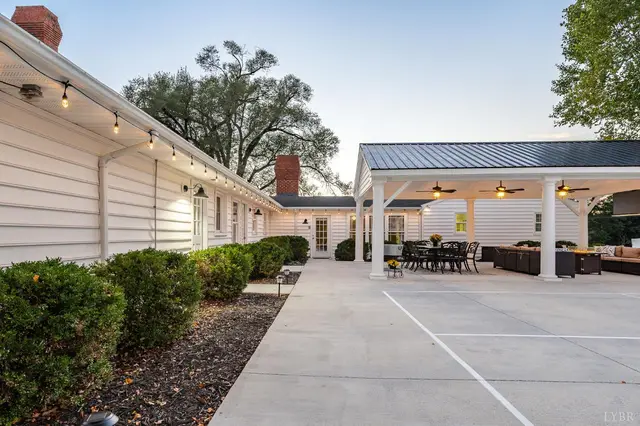 Back of the house with string lights and a covered pavilion at 1351 Country Estates Drive, Lowry VA