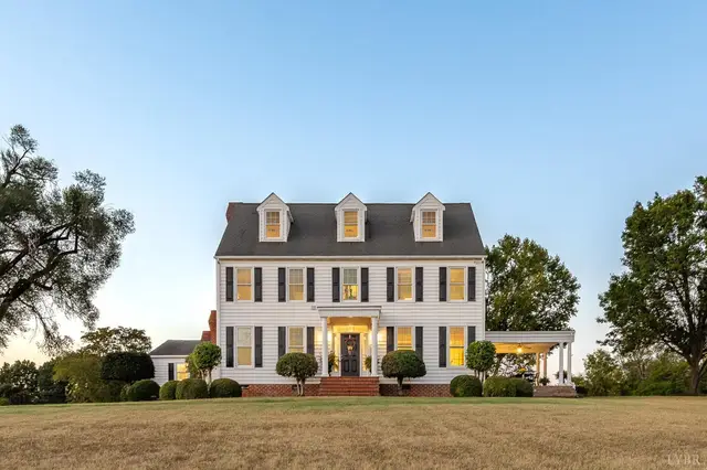 Front of the house, two-story colonial with three dormers and a lawn at 1351 Country Estates Drive, Lowry VA