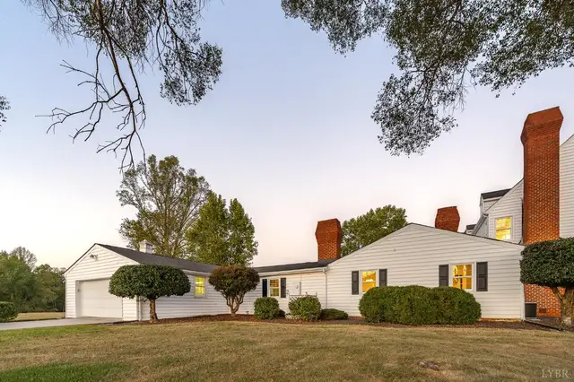 Side of the house with brick chimneys and the garage wing at 1351 Country Estates Drive, Lowry VA