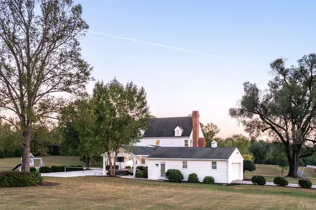 Rear view of the house and garage wing across the lawn at 1351 Country Estates Drive, Lowry VA