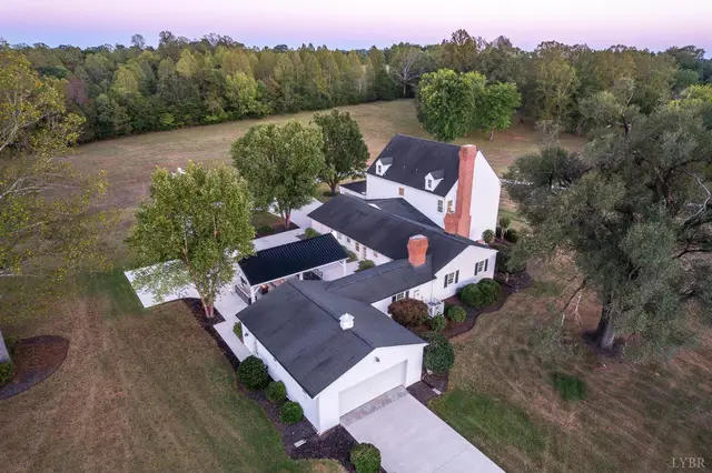 Aerial view of the house, garage wing and brick chimney at 1351 Country Estates Drive, Lowry VA