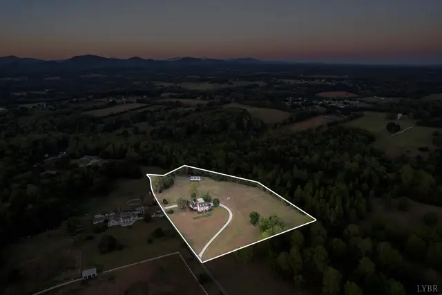 Aerial view at dusk with the property lines outlined in white at 1351 Country Estates Drive, Lowry VA
