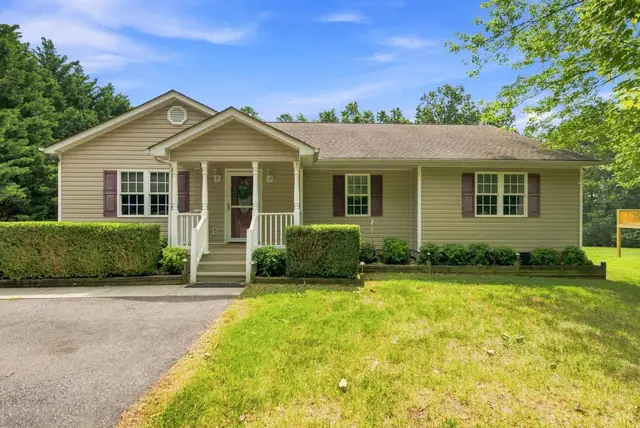 Front of the house, one-story with tan siding and a covered front porch at 1378 Greenhouse Road, Rustburg VA