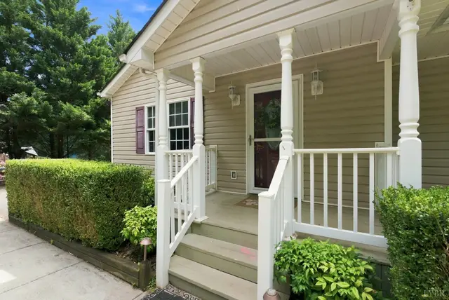 Covered front porch with white columns and railings at 1378 Greenhouse Road, Rustburg VA