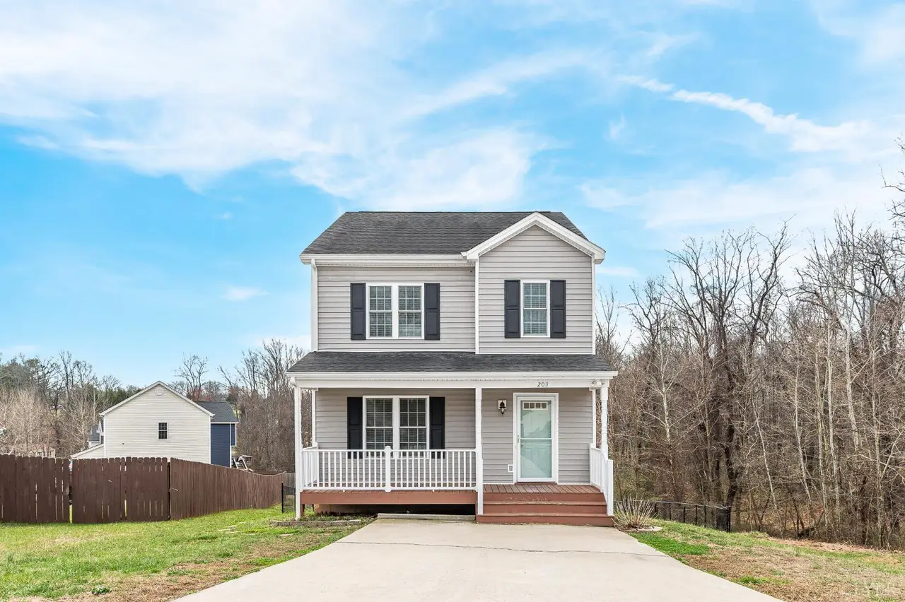Front of the house, two-story with gray siding and a white porch railing at 203 Bonterra Pl, Lynchburg VA