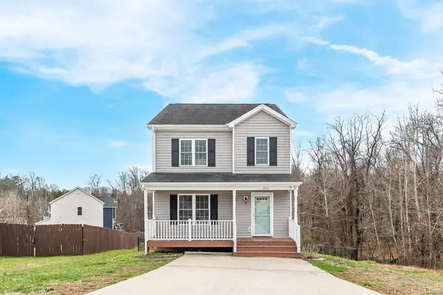 Front of the house, two-story with gray siding and a white porch railing at 203 Bonterra Pl, Lynchburg VA
