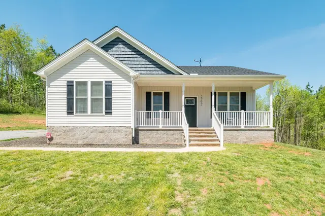 Front of the house, one-story with a covered front porch and white railings at 2292 Wheeler Road, Lynchburg VA