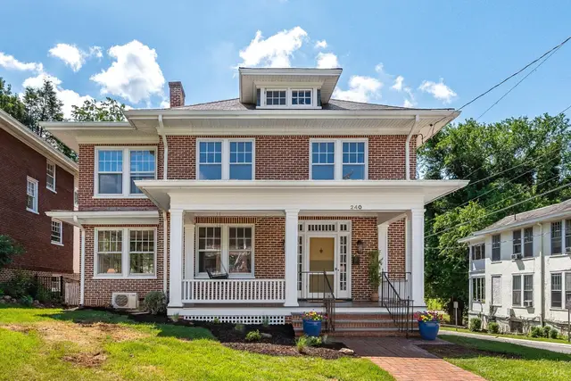 Front of the house, two-story brick with a columned front porch and dormer at 240 Warwick Lane, Lynchburg VA