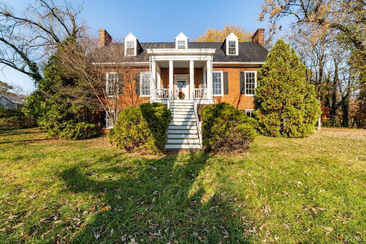 Front of the house, brick with a columned portico and tall front steps at 2601 Murger Street, Lynchburg VA