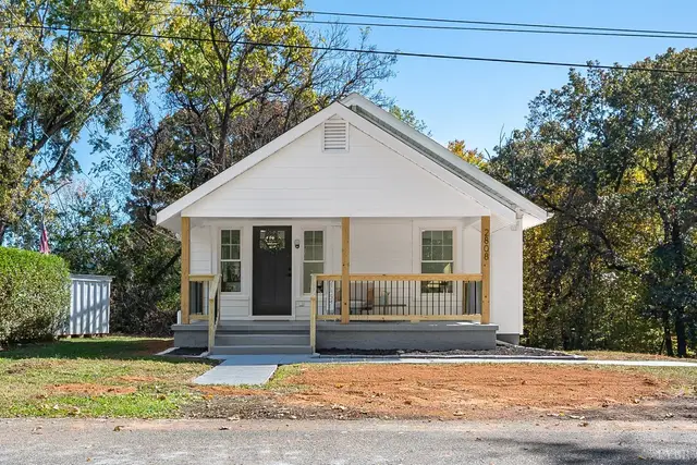 Front of the house, white one-story with a covered porch and black door at 2808 Raleigh Street, Lynchburg VA