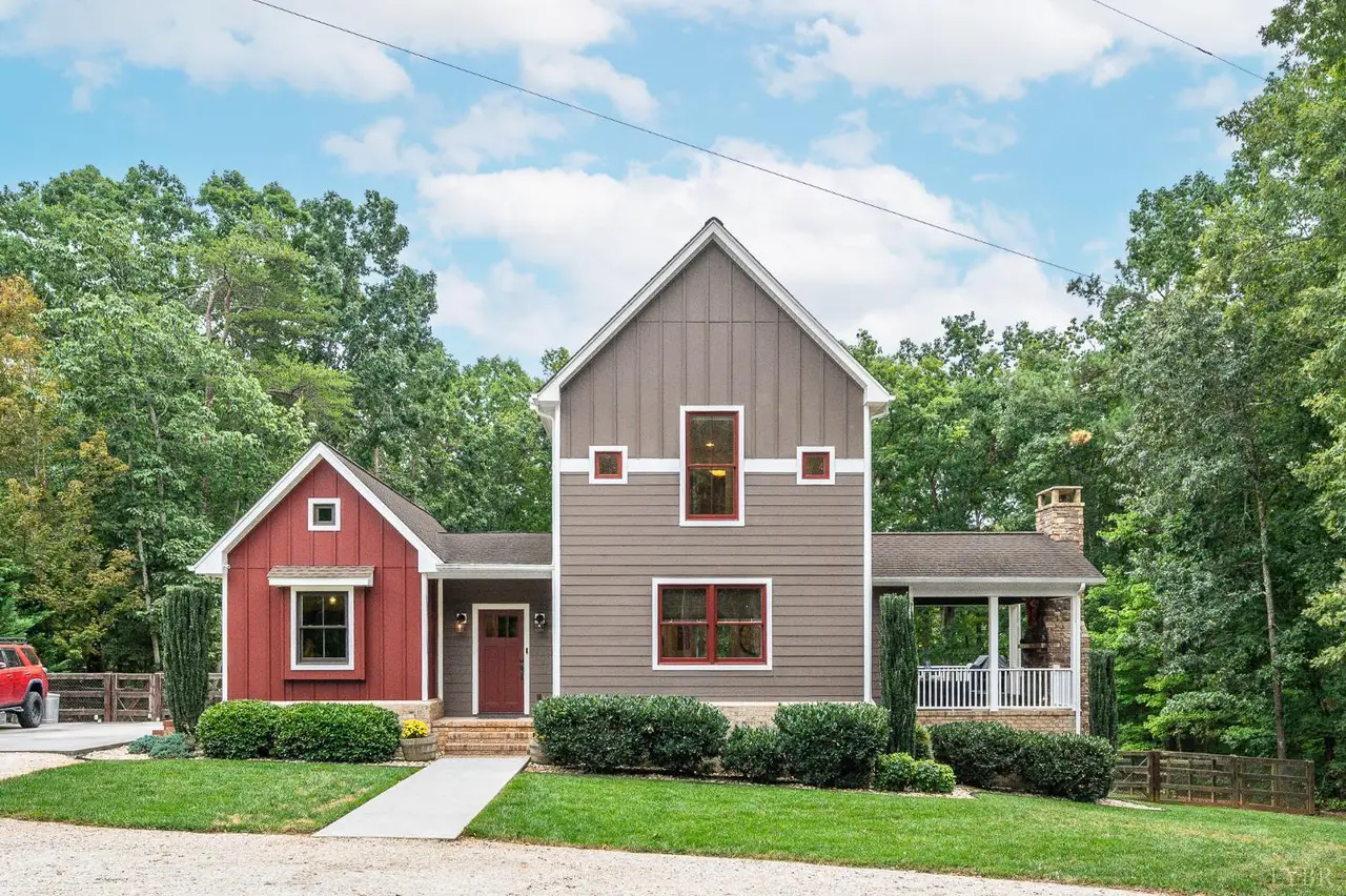 Front of the house with red and gray siding and a side porch at 2842 Chilton Road, Appomattox VA