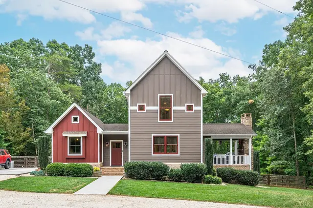Front of the house with red and gray siding and a side porch at 2842 Chilton Road, Appomattox VA