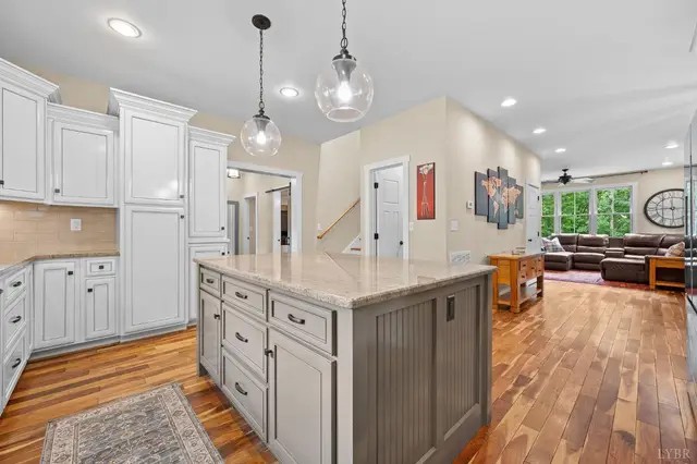 Kitchen island with pendant lights looking into the living room at 2842 Chilton Road, Appomattox VA
