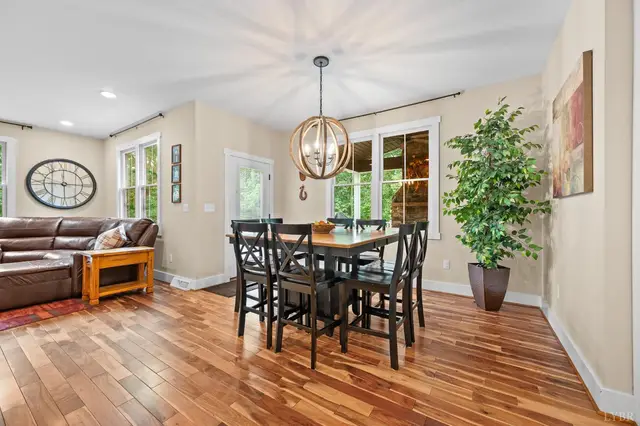 Dining area with a dark wood table and an orb chandelier at 2842 Chilton Road, Appomattox VA