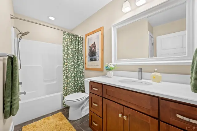 Bathroom with a tub shower and wood vanity at 2842 Chilton Road, Appomattox VA