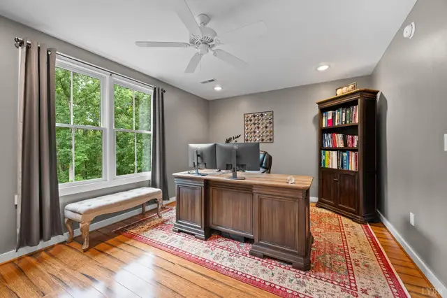 Office with a wood desk and bookcase at 2842 Chilton Road, Appomattox VA