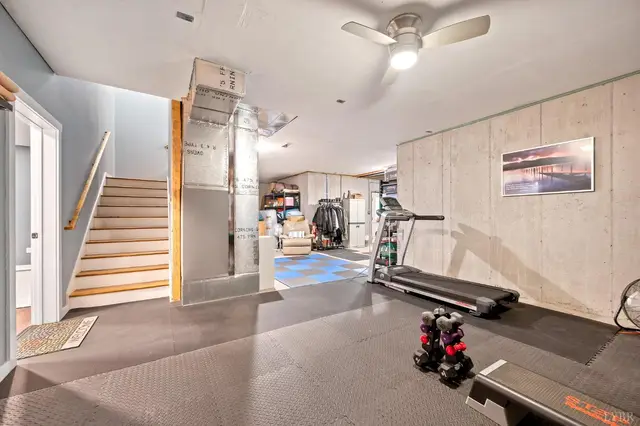 Unfinished basement with stairs and exercise equipment at 2842 Chilton Road, Appomattox VA