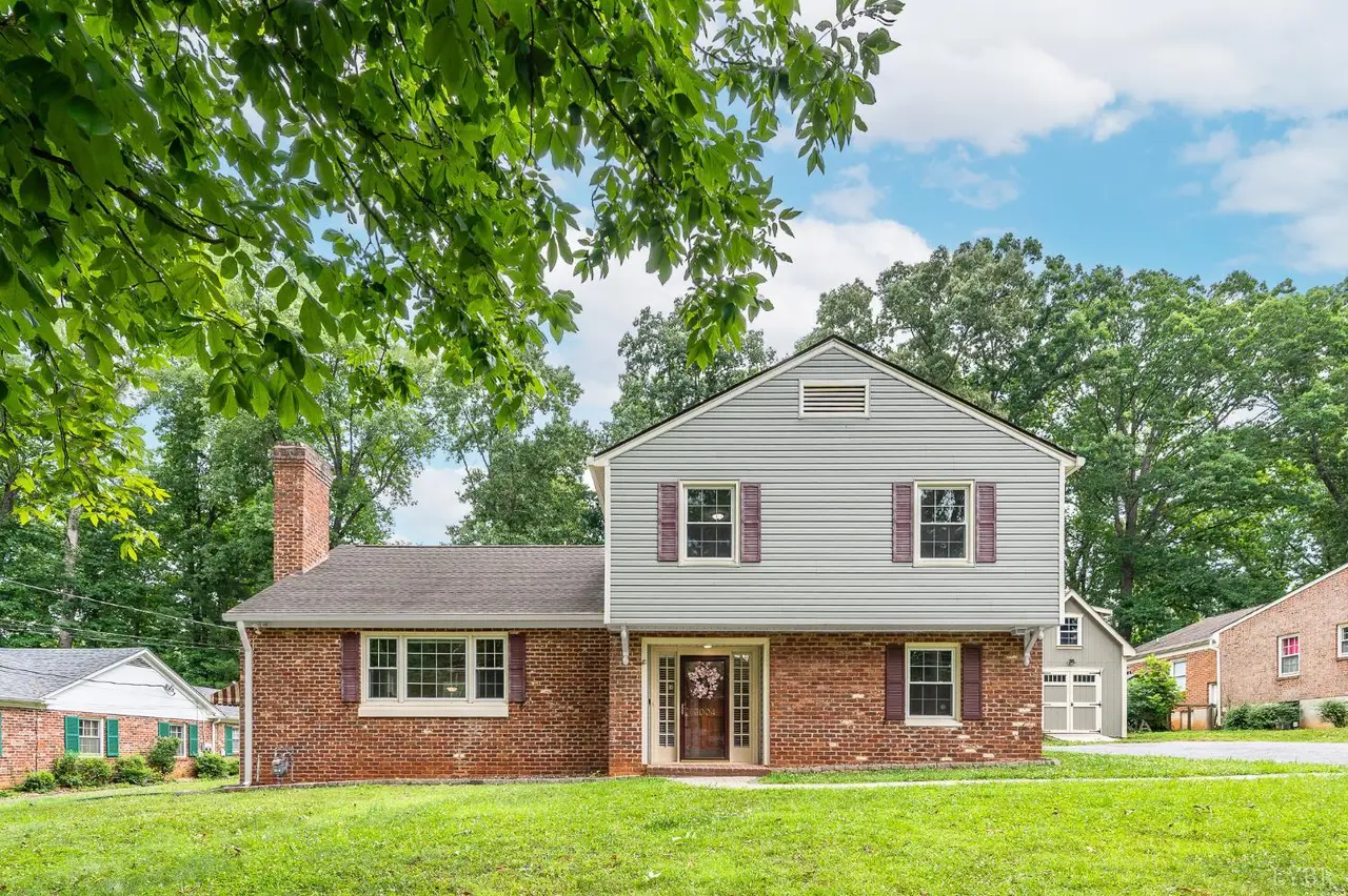 Front of the house, brick and siding split-level with a chimney at 3004 Ravenwood Drive, Lynchburg VA
