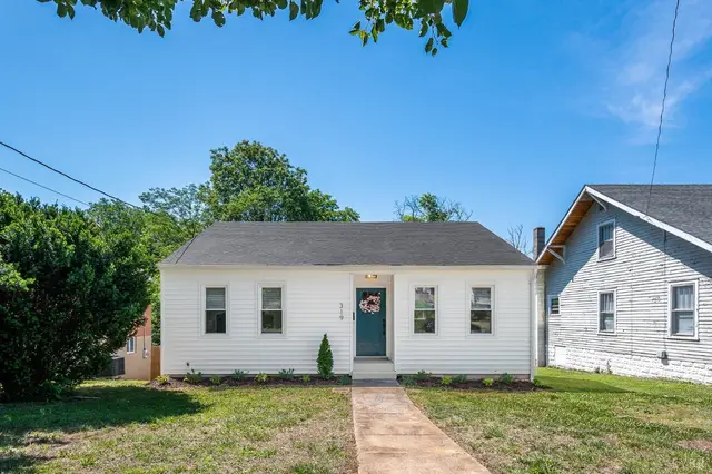 Front of the house with a concrete walkway through the lawn at 319 Warren Avenue, Lynchburg VA
