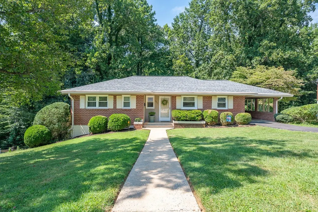 Front of the one-story brick house with a walkway through the lawn at 3432 Landon Street, Lynchburg VA