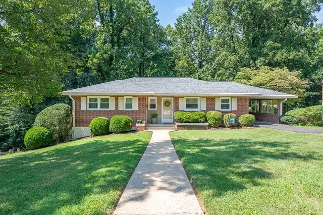 Front of the one-story brick house with a walkway through the lawn at 3432 Landon Street, Lynchburg VA